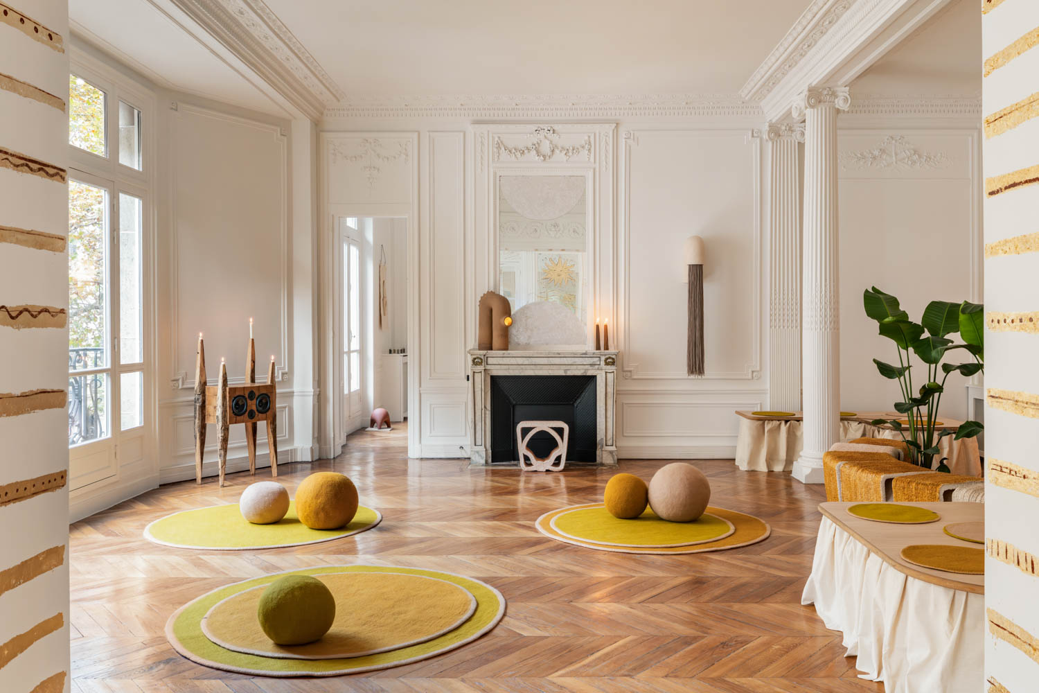 living room with multiple round carpets holding balls