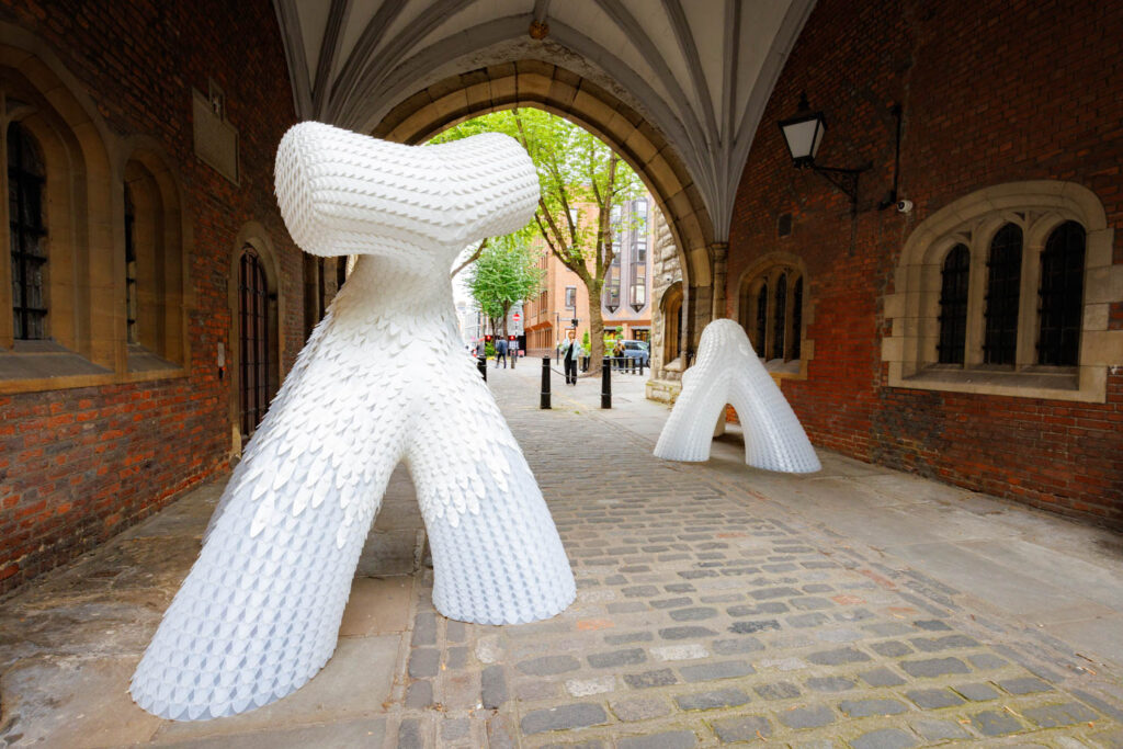 white abstract sculptures in a tunnel