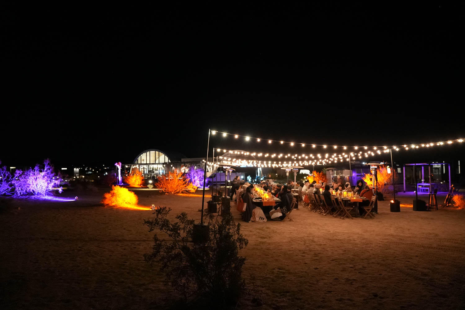 giants of design retreat attendees enjoy dinner under the stars