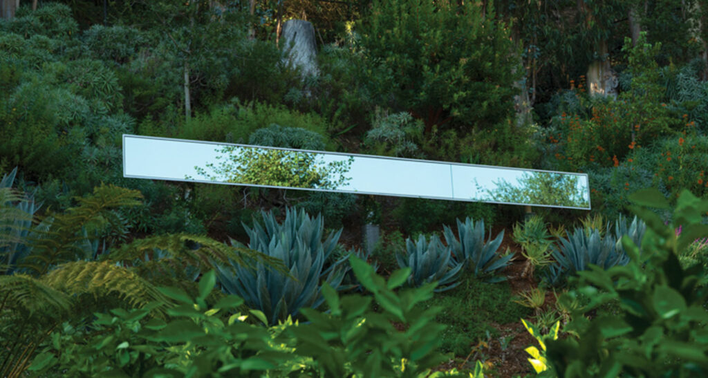 reflective sculpture in the woods