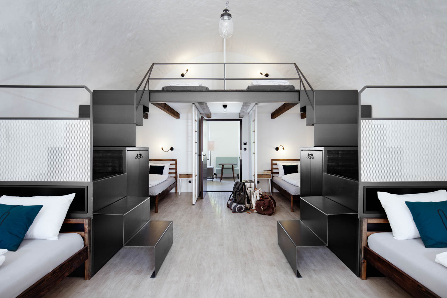 interior of dorms with black bunk beds and lighting