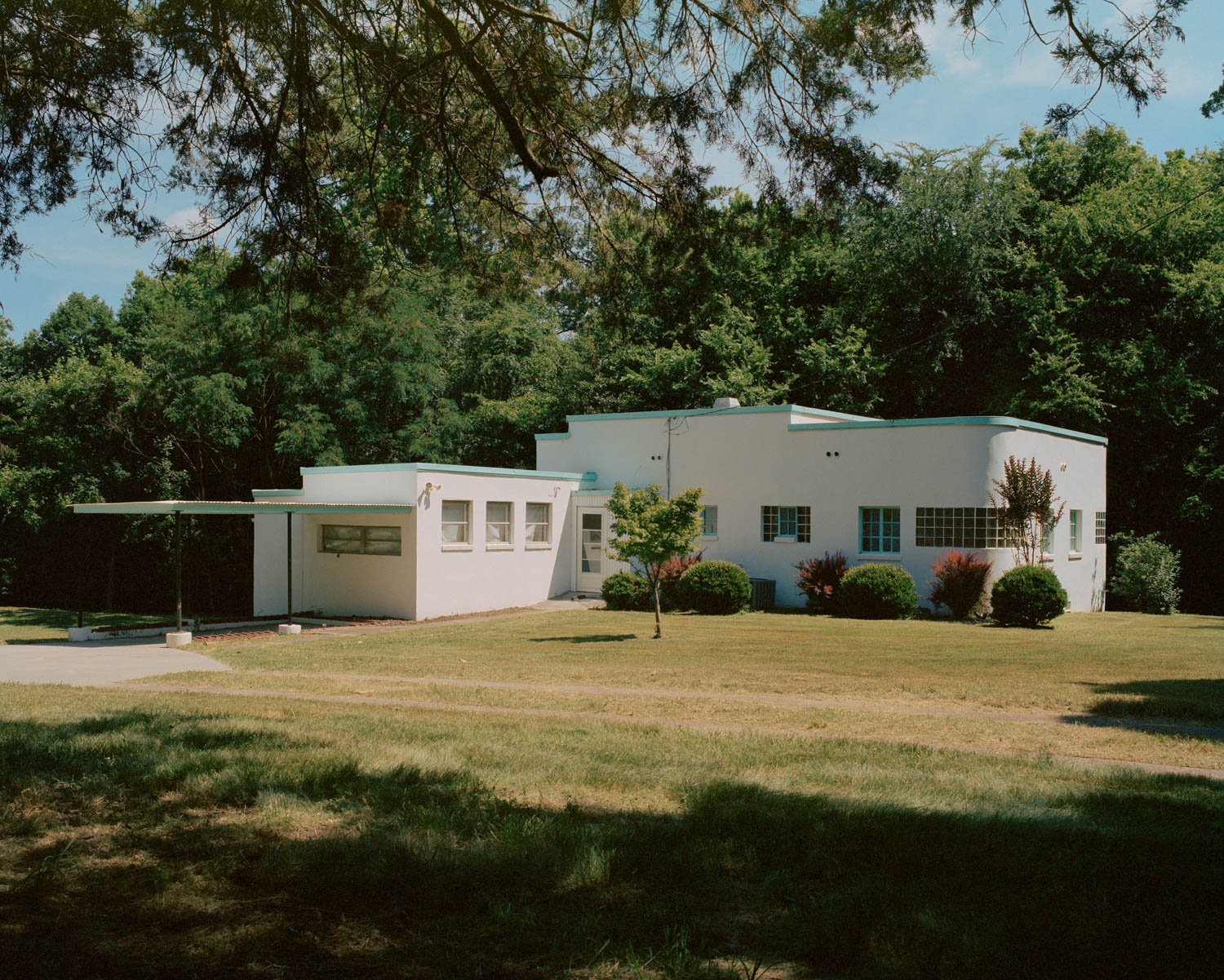 exterior shot of home amidst a grassy field