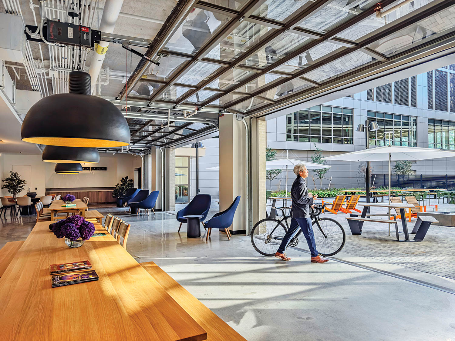 cafe with open garage doors leading to an open courtyard