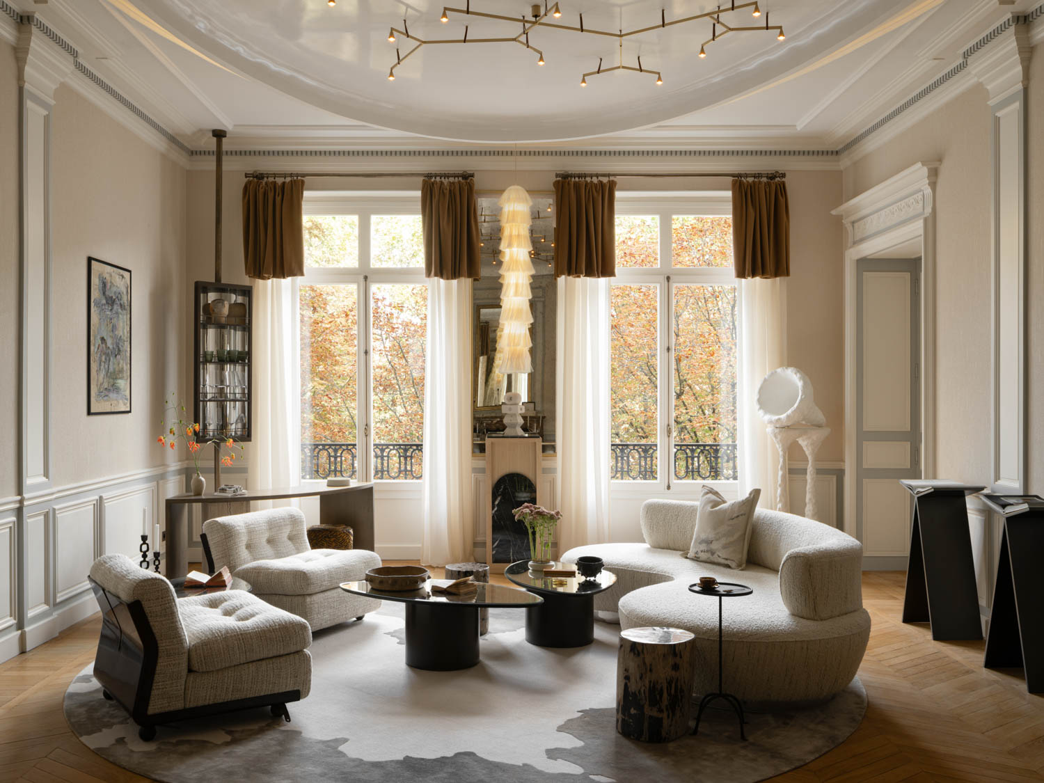 living room with bright white drapes, curved sofas and view of outdoors