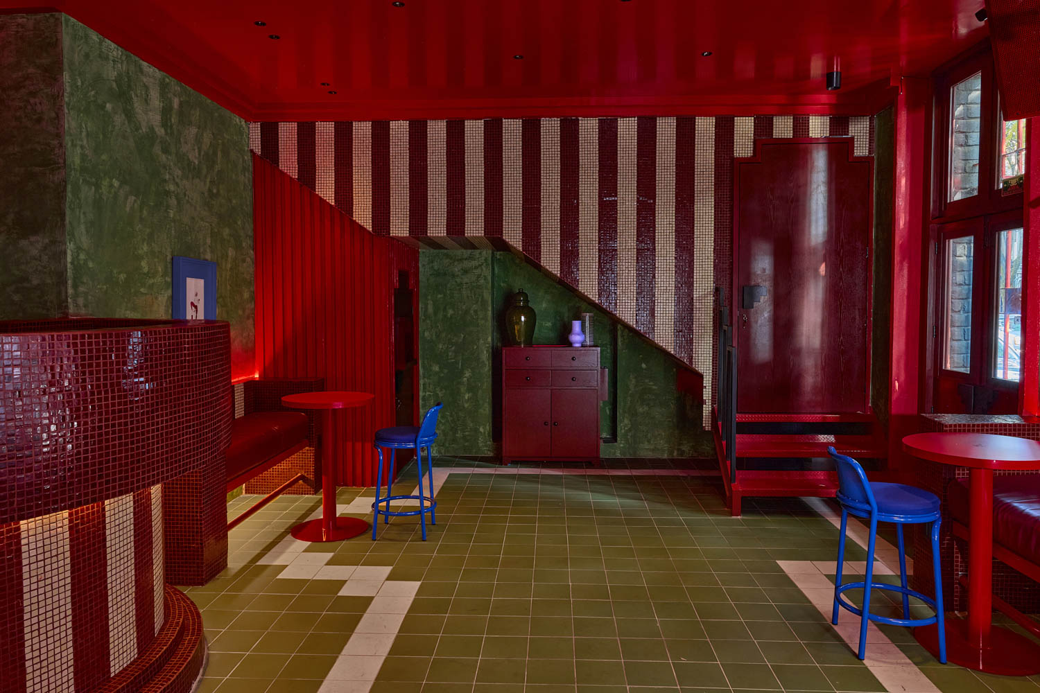 dining area with green patina and striped walls