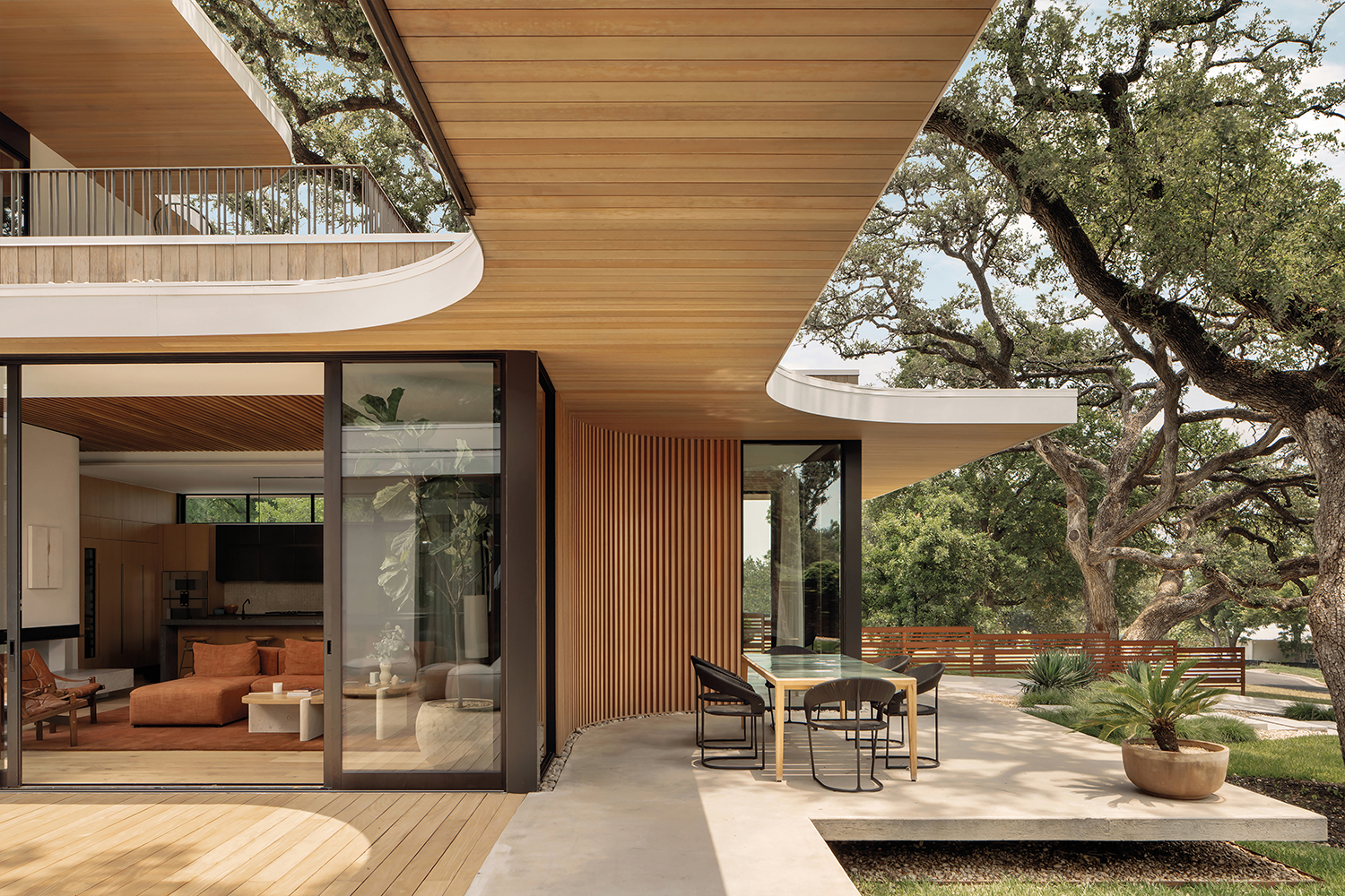 neutral warm indoor-outdoor seating area on a contemporary Austin home