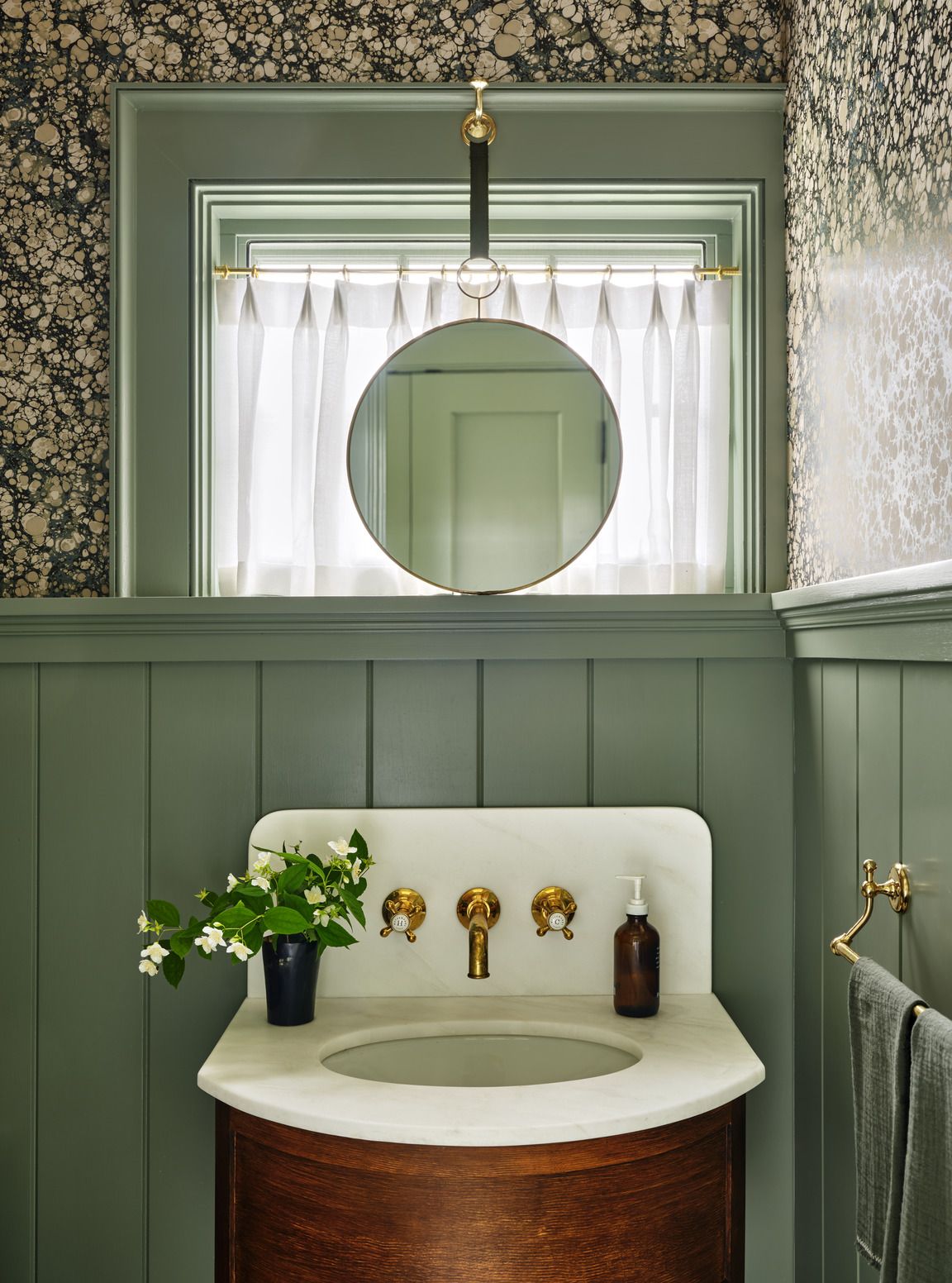 tiny powder room designed by chauncey boothby