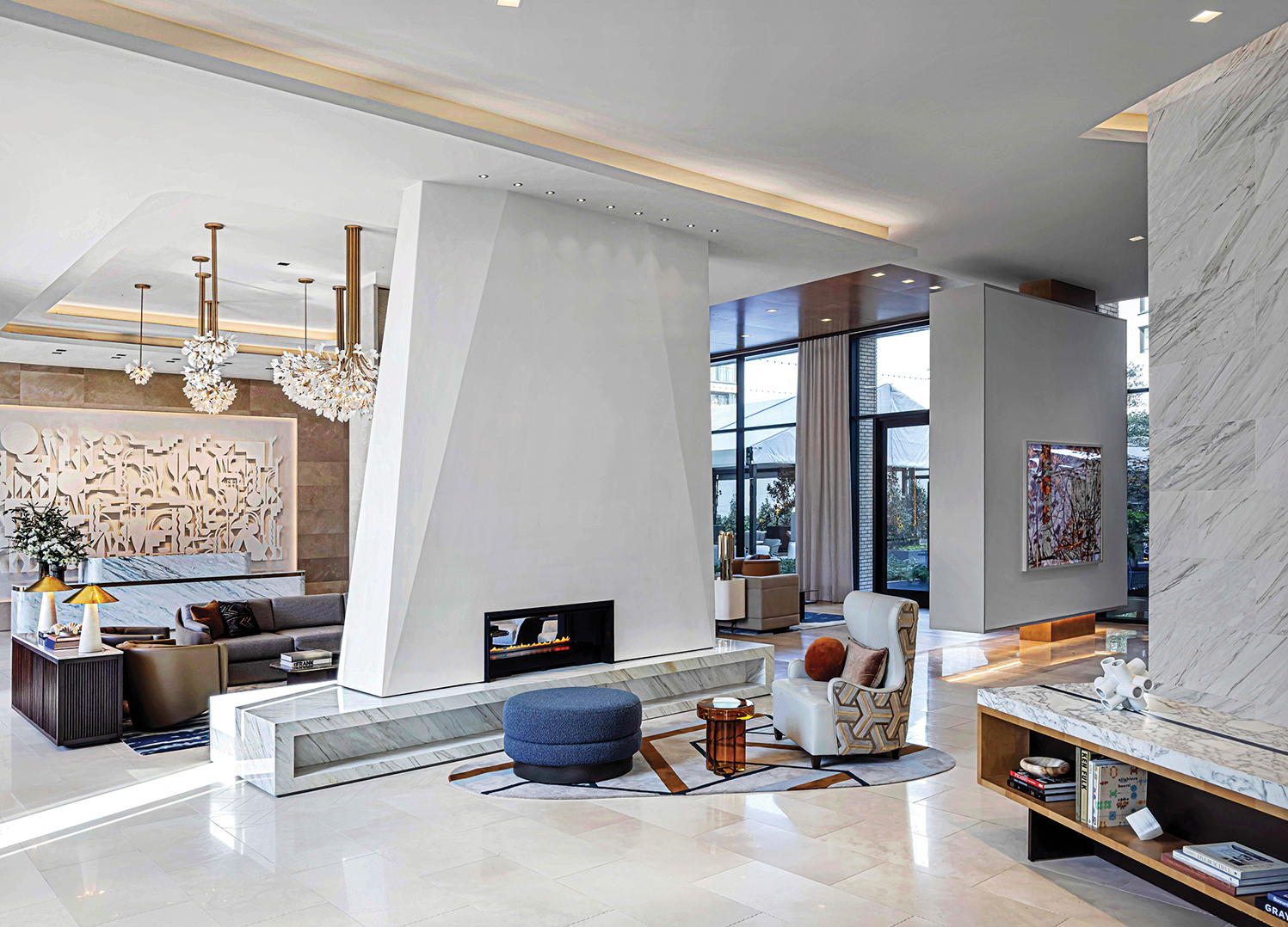 A living room with a large marble fireplace