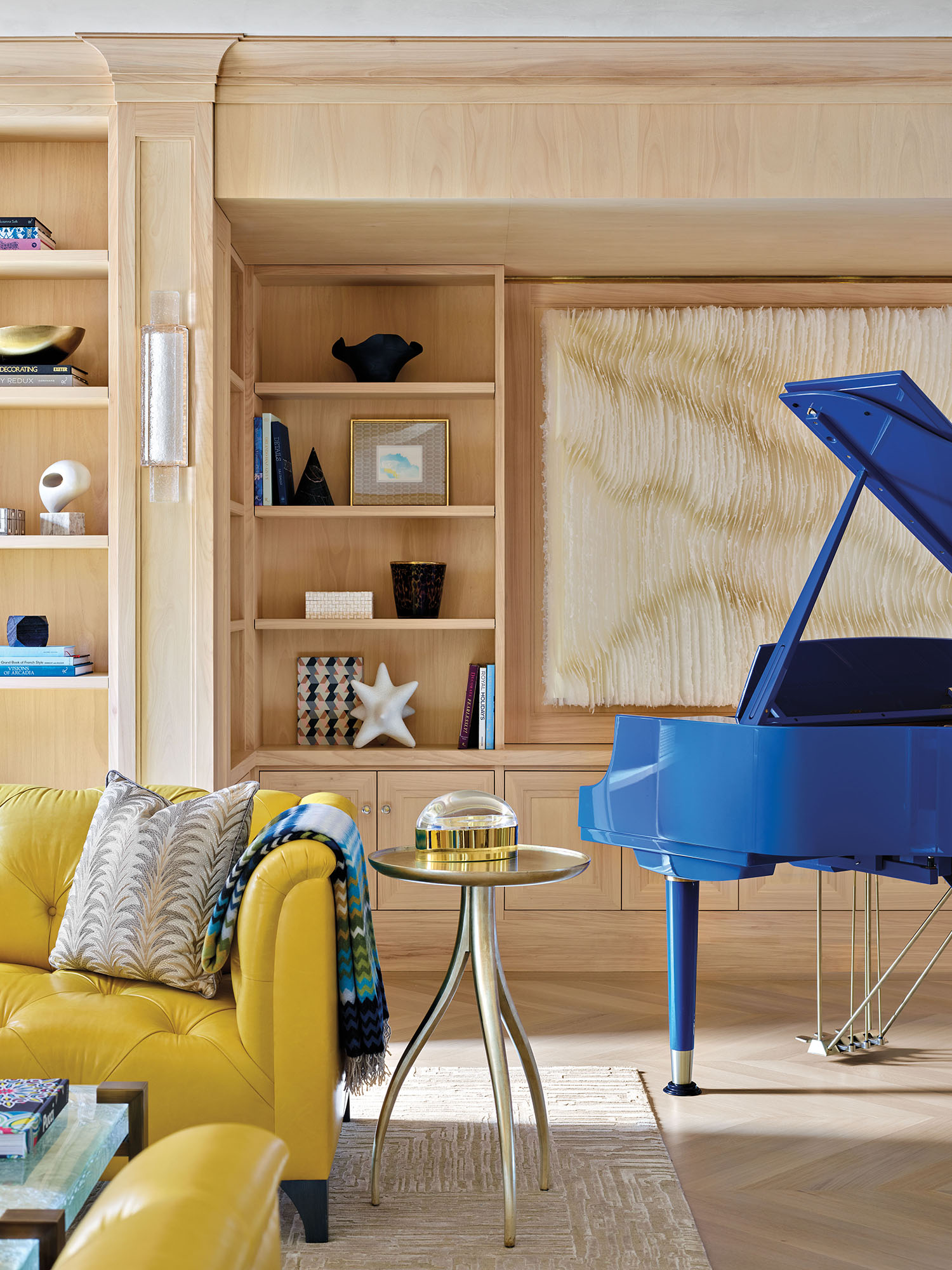 library with yellow couch and blue piano