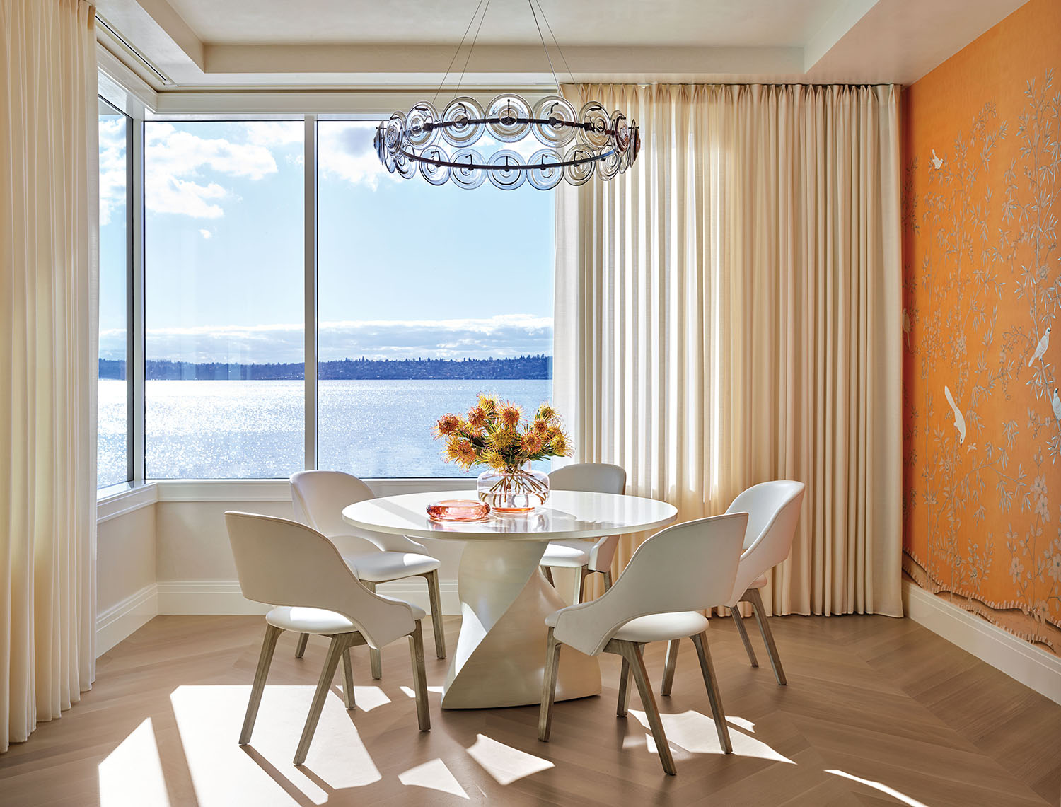 dining area with tangerine chinoiserie paper by de Gournay