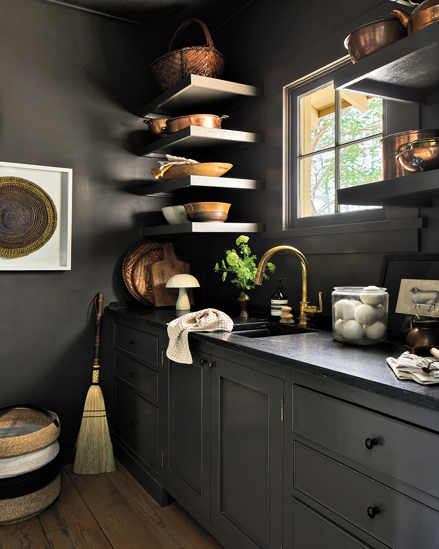 black laundry room with floating shelves