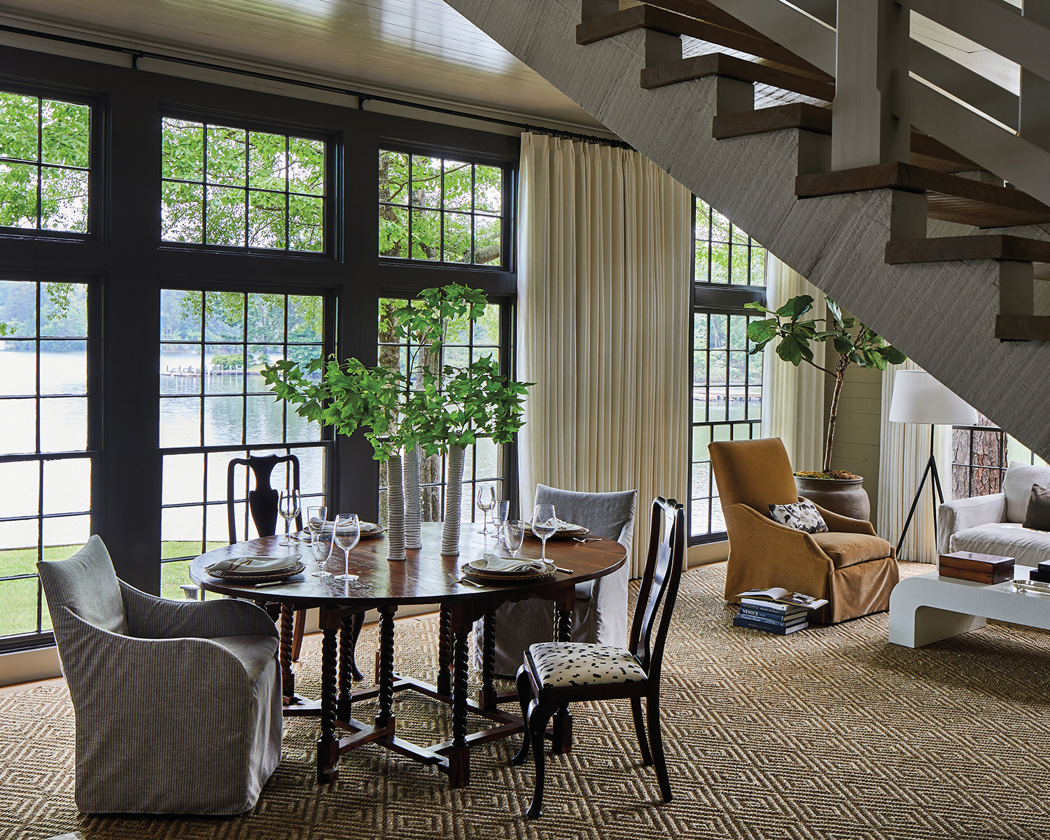 traditional living area with a separate dining zone flanked by a staircase