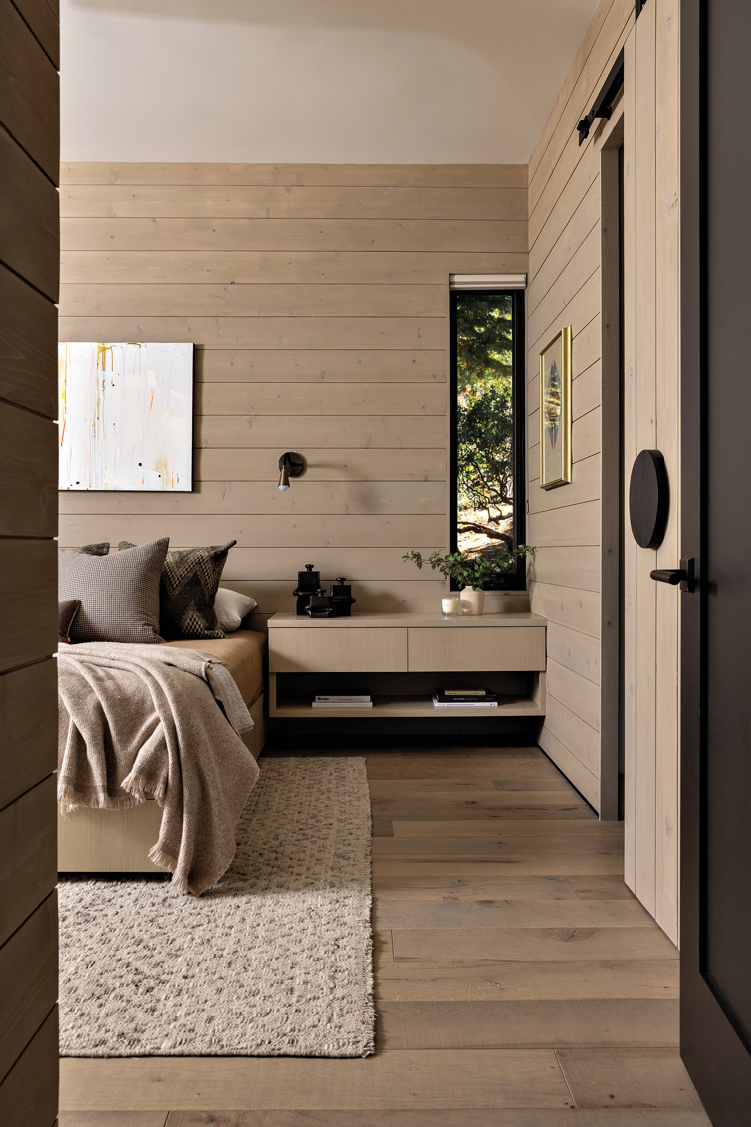 horizontal cedar panels in minimalist Scandinavian primary bedroom