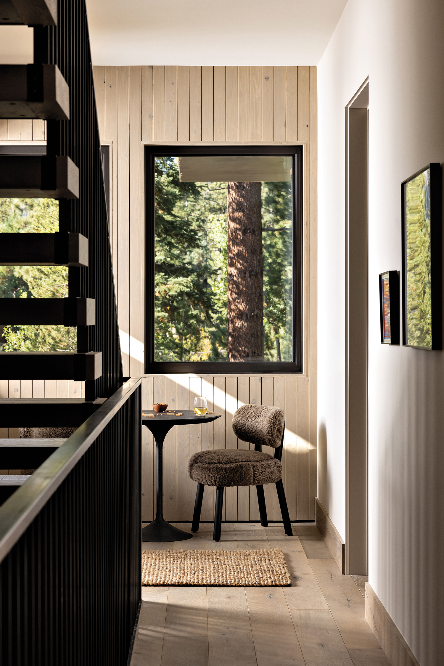 seating area near stairs beneath Sierra Pacific Windows