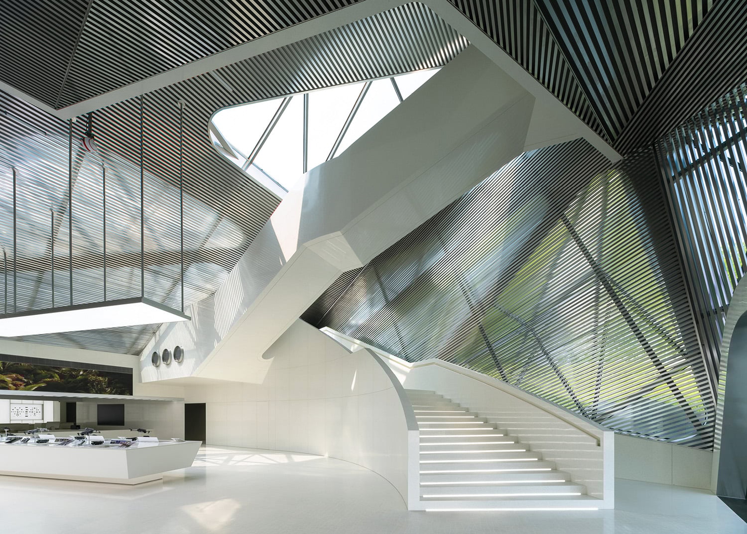 A white kitchen and stairs in a modern house