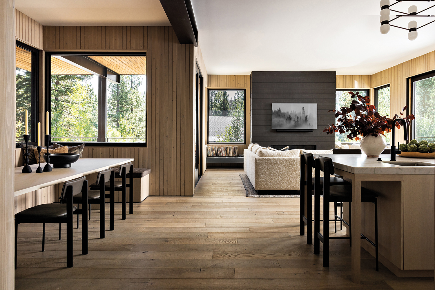 open floor plan showcasing scandinavian inspired the kitchen, dining and living space